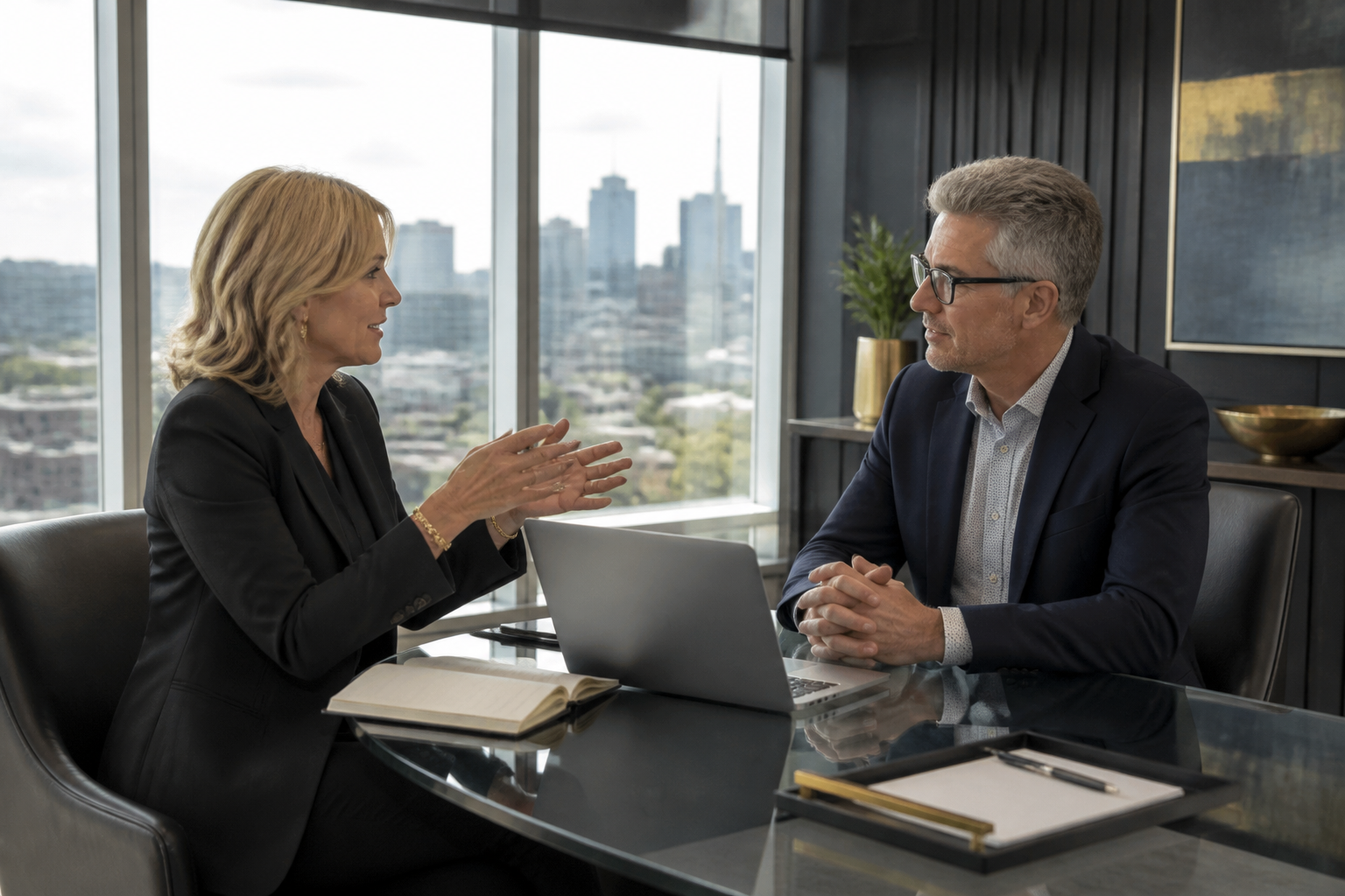 Executive coaching conversation between a coach and senior leader in a modern boardroom